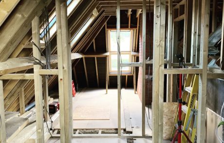 David Strudwick Gallery Image – 7 Timber frames inside a building under construction